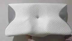 Memory foam cervical pillow with ergonomic neck support and breathable design for improved sleep quality