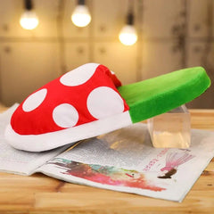 Multifunctional Mushroom Piranha Plush soft pillow and toy with red mushroom cap and green stem design on a wooden table.