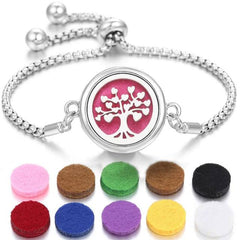 Stainless steel perfume bracelet with tree design and multiple colored scent pads for fragrance diffusion.
