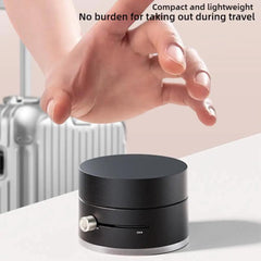 Compact black suction cup magnetic phone holder with one-click pressure release for travel convenience