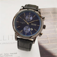 Men's quartz watch with black leather strap, black dial, stainless steel case, and chronograph features