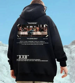 Black hoodie featuring a graphic inspired by the Last Supper with floral elements and bold text on the back.