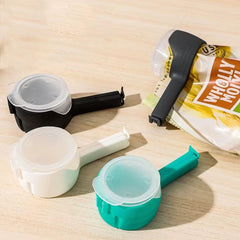 Food sealing clips with pour spout in black, white, teal, sealing snack and seasoning bags to keep food fresh