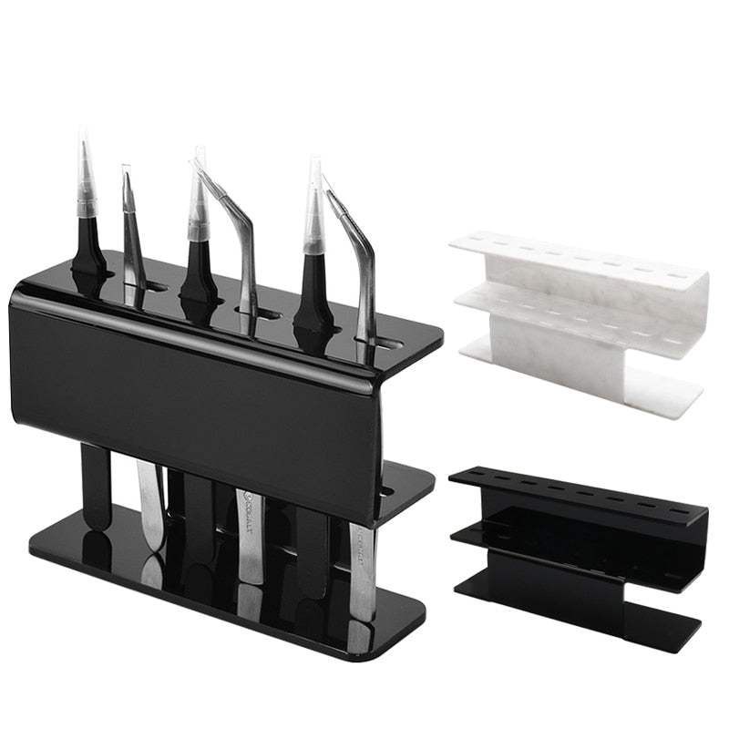 Acrylic eyelash tweezers holder with six slots for organizing beauty tools, available in black and white designs