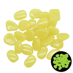 Yellow glow in the dark garden pebbles for outdoor decoration and pathways