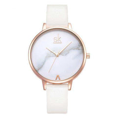 Shengke Fashion Watch for Women with white marble dial and rose gold case, white leather strap, elegant minimalist design