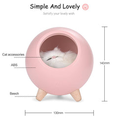 Pink LED cat light with wooden legs, 130x143mm, warm glow, and playful design