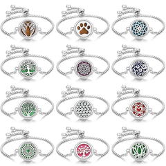 Collection of stainless steel perfume bracelets with adjustable chains featuring various intricate designs such as wings, paw print, tree of life, mandala, and floral patterns.