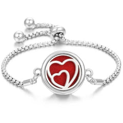 Elegant stainless steel perfume bracelet with adjustable chain and red heart design diffuser pad
