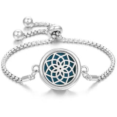 Elegant stainless steel perfume bracelet with adjustable chain and intricate floral design diffuser
