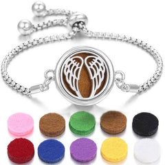 Stainless steel perfume bracelet with angel wing design and colorful scent pads for fragrance diffusion.