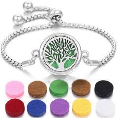 Stainless steel perfume bracelet with tree design and colorful scent pads for adjustable fragrance diffusion.