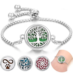 Stainless steel perfume bracelet with adjustable chain and interchangeable scent diffuser charms including tree, infinity paw, waves, and floral designs.