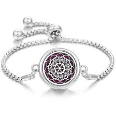Elegant stainless steel perfume bracelet with adjustable chain and intricate floral design diffuser centerpiece
