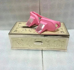 Pink Lazy Periscope Horizontal Reading Glasses designed for hands-free reading while lying flat, resting on an ornate cream-colored box