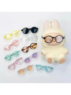 Set of colorful transparent plastic Labubu glasses for 15cm dolls with a plush doll wearing black round Labubu glasses.