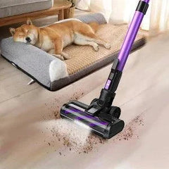 Poweart V870 Cordless Vacuum Cleaner in purple cleaning pet hair and dirt on floor near a dog bed with sleeping dog.