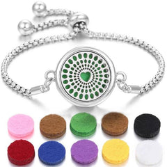 Stainless steel perfume bracelet with adjustable chain and colorful scent pads for fragrance diffusion.