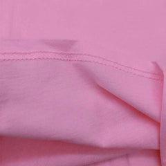 Close-up of pink Labubu Birthday T Shirt fabric for toddler girls, soft cotton material