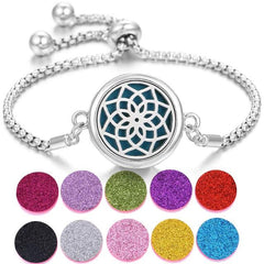 Stainless steel perfume bracelet with intricate design and colorful scent pads for adjustable fragrance diffusion