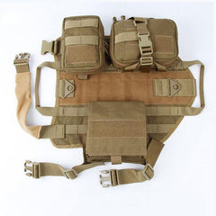 Tactical military dog harness with adjustable straps, padded interior, heavy-duty metal attachments, and multiple storage pouches in tan color