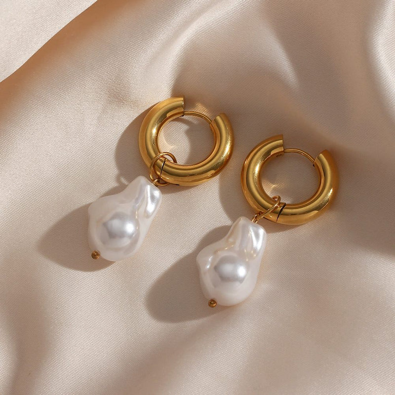 Gold chunky hoop Water Drop Earrings with removable baroque-style pearl charms on silk background