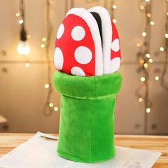 Multifunctional Mushroom Piranha Plush toy with red and white spotted soft head and green stem base on table with blurred lights background
