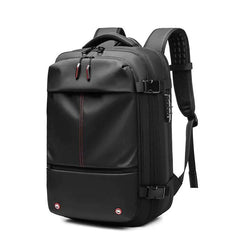 Black vacuum compression backpack with ergonomic padded straps, multiple compartments, and USB charging port for travel and daily use