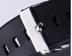 Close-up of black rubber strap and silver buckle of fashion men's unique LED digital watch