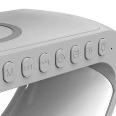 Close-up view of control buttons on a sleek gray multi-function Bluetooth lamp with lighting and music features