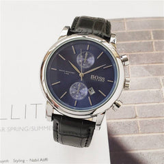 Men's quartz watch with blue dial, stainless steel case, and black leather strap.