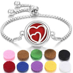 Stainless steel perfume bracelet with heart design and replaceable scent pads in multiple colors