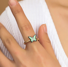 Fidget spinner rotatable ring with butterfly design on woman's finger