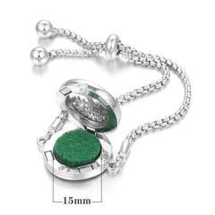 Sleek stainless steel perfume bracelet with adjustable chain and 15mm scent pad diffuser compartment.