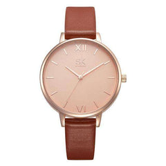Shengke Fashion Watch for Women with rose gold dial and brown leather strap, minimalist elegant design