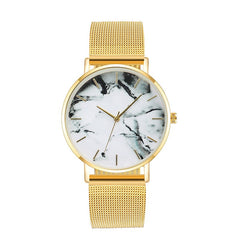 Rose gold mesh band watch with minimalist marble dial and slim design