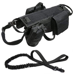 Black tactical military dog harness with adjustable straps, padded interior, reinforced handle, and heavy-duty leash attachment for outdoor use