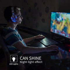 Gamer using Led Light Wired Gamer Headset with blue LED lights and night light effect while playing on computer.