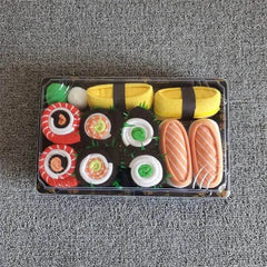 Unisex Sushi Socks set packaged to look like sushi rolls with vibrant, playful designs on a gray background