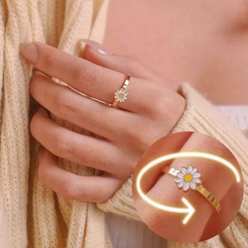Fidget spinner rotatable ring for women with flower design on metal band worn on finger