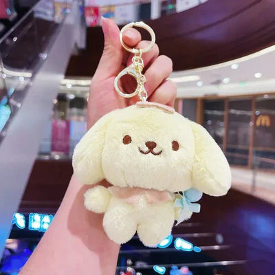 Soft yellow plush couple dolls keychain featuring a Mini Yugui dog charm with a gold keyring and clasp