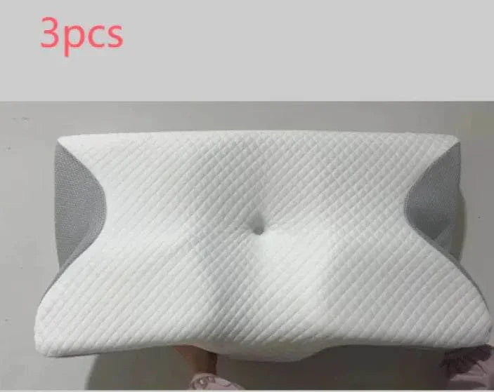 Set of three memory foam cervical pillows with ergonomic design and breathable fabric for neck support and comfort.