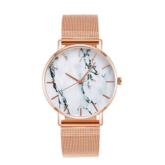 Rose gold mesh band watch with minimalist marble dial and slim profile