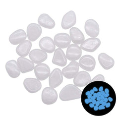 Glow in the dark garden pebbles glowing blue with smooth translucent resin surface for outdoor décor and aquariums